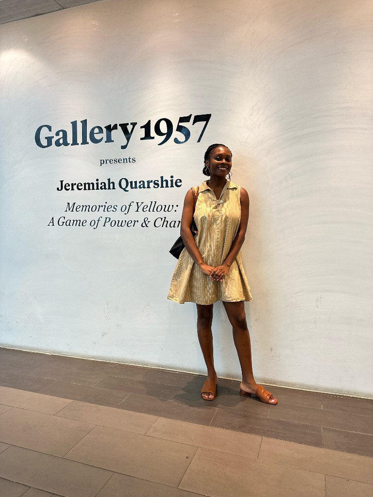Precious Yeboah smiling in an art gallery.